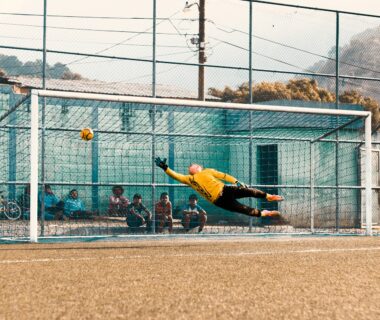 Retro gamepad on neon-lit desk