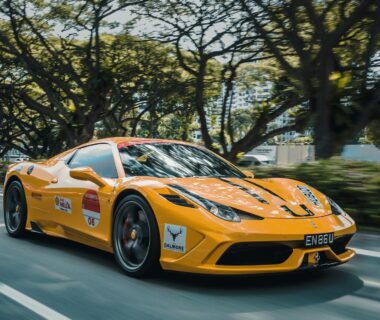 Red Ferrari on a mountain highway (photo: Alex Jodoin via Unsplash)