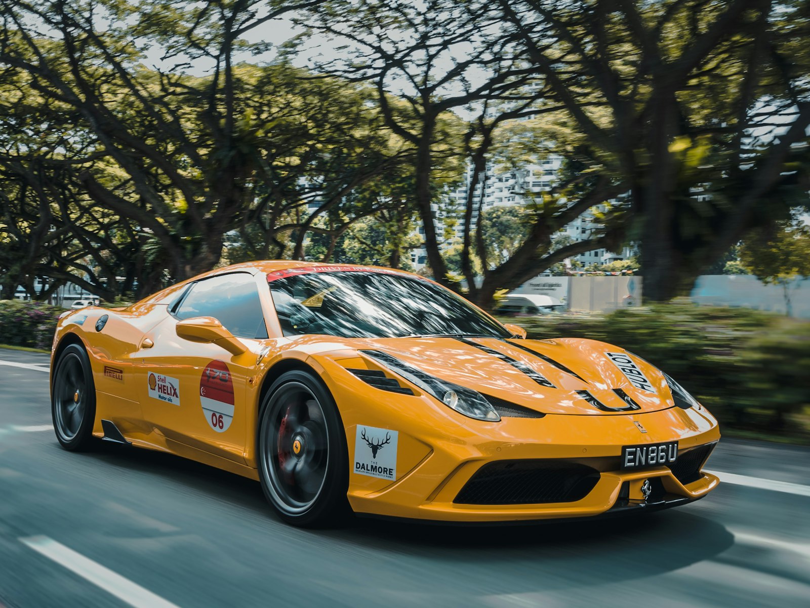 Red Ferrari on a mountain highway (photo: Alex Jodoin via Unsplash)
